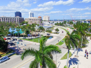 Colorful storefront in Little Haiti, FL with signage reading 'Fianzas'.