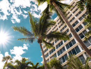 Doral, FL bond services signage against a blue sky backdrop.