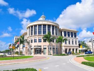 Doral, FL bond services signage against a blue sky backdrop.